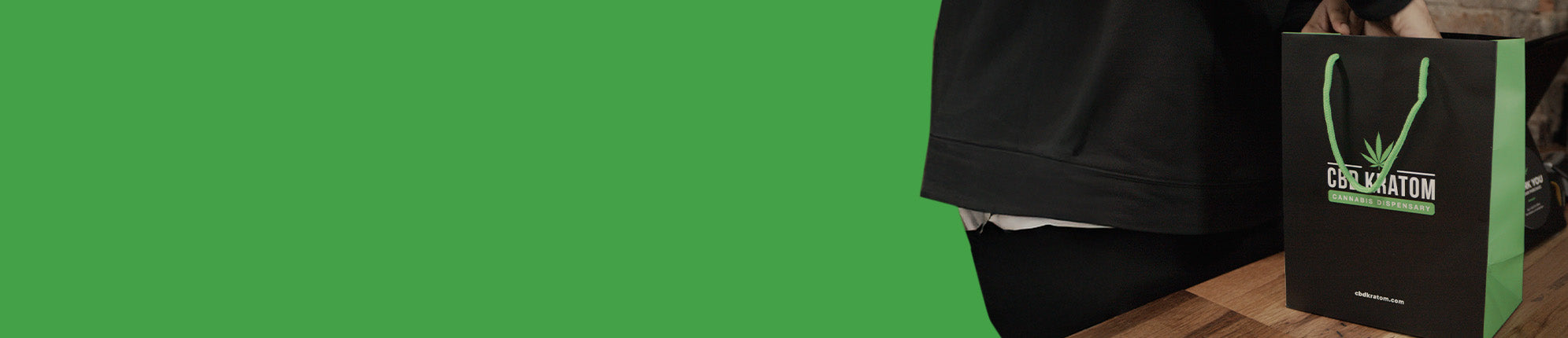 CBD Kratom shopping bag at checkout counter with text promoting pickup subscription: “Ready to Set It & Forget It? Start Your Pickup Subscription to Make Restocking Easy.”